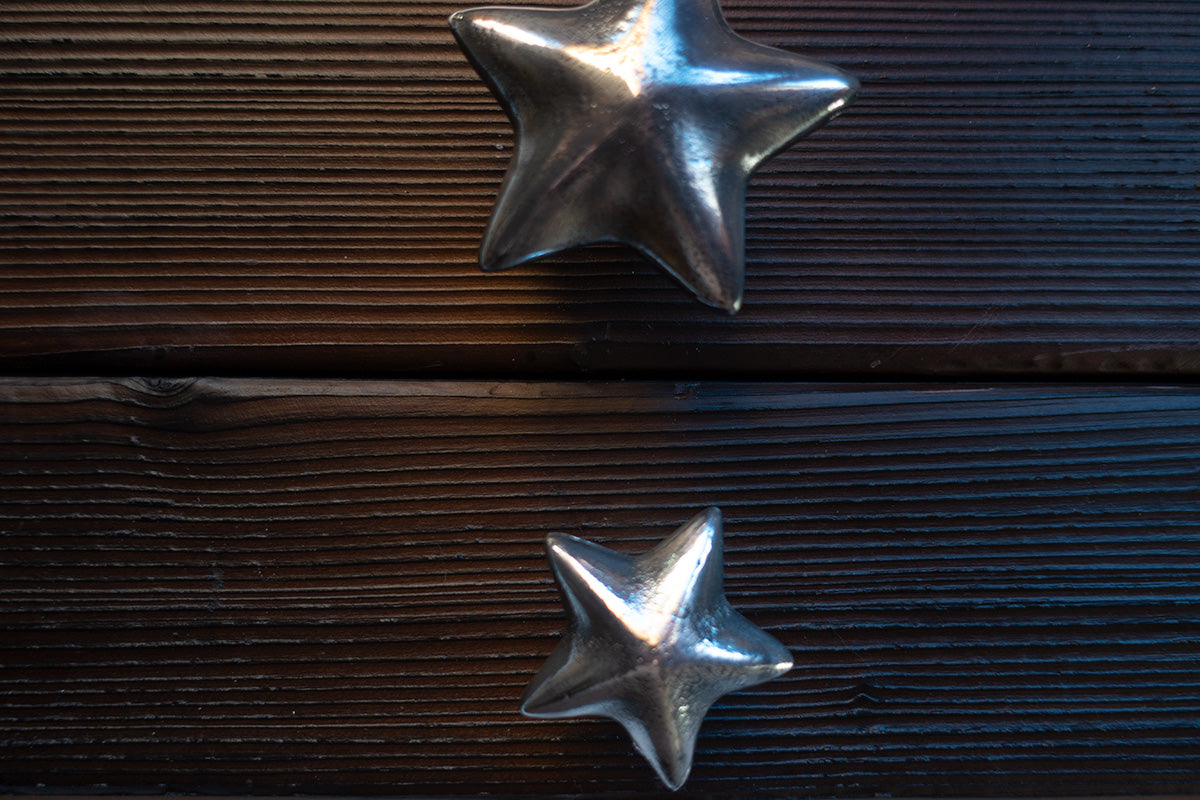 Coastal cabinet pull shaped like a starfish