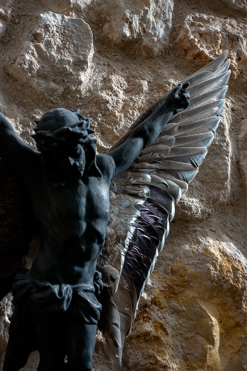 ceramic figure of jesus with wings
