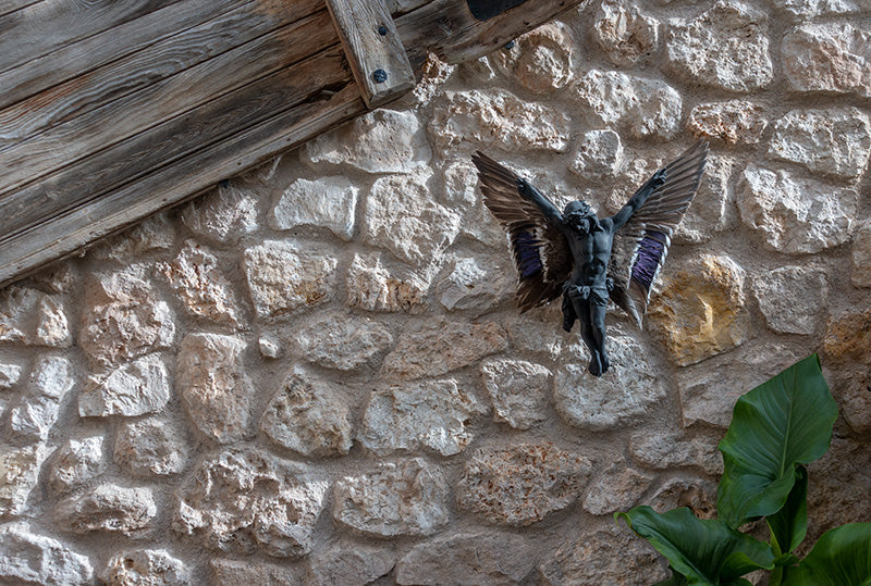 Carbon Jesus sculpture with wings
