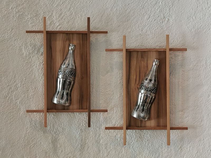 wall mounted coke bottle sculptures a contemporary look at a global polluter