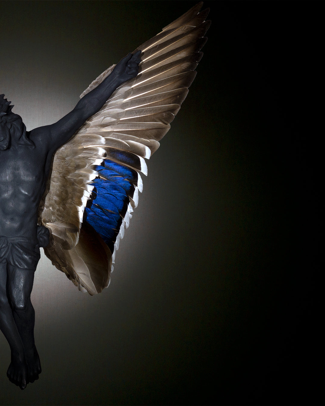 Carbon jesus with wings sculpture