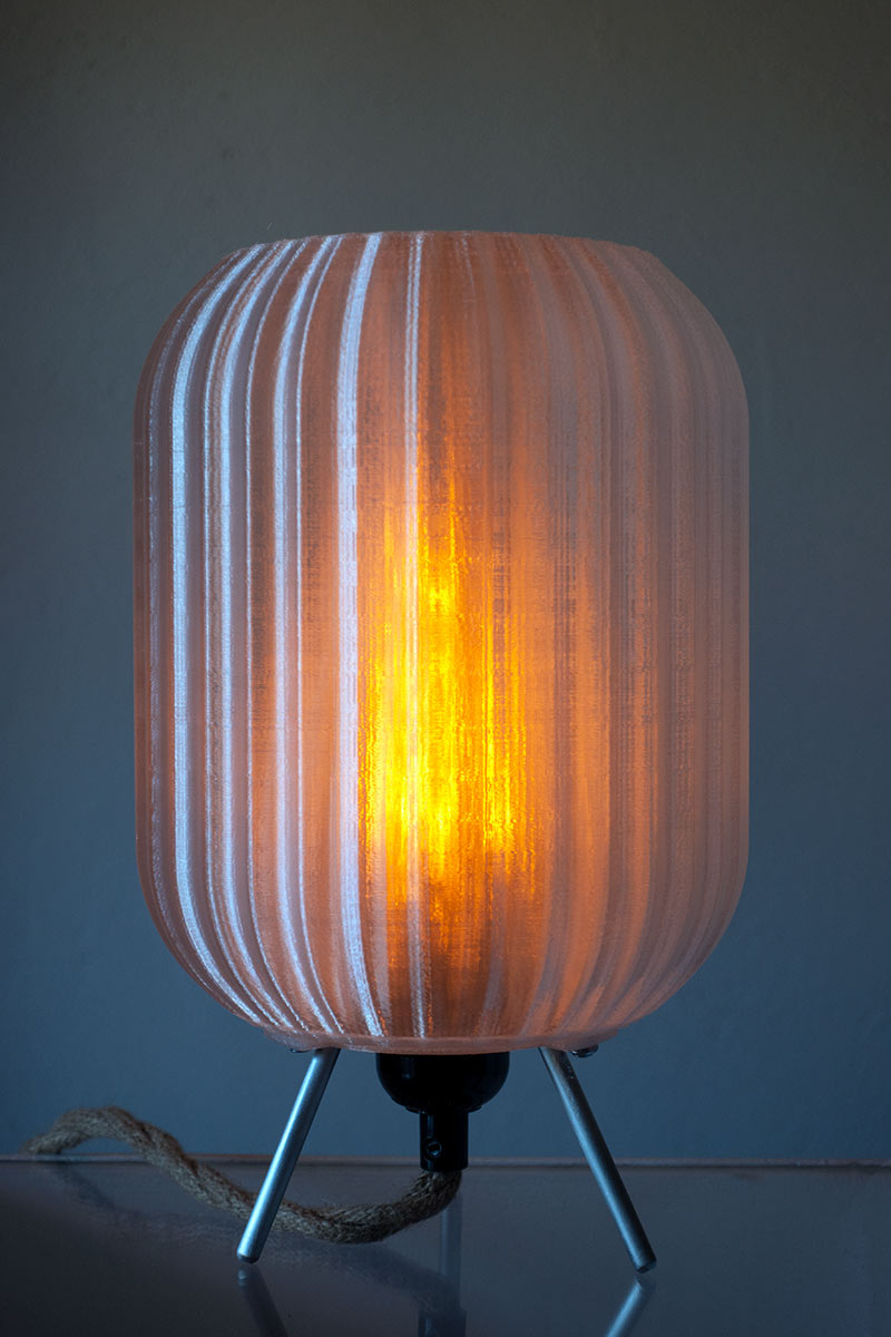 Sculptural sustainable lamp with flame LED bulb