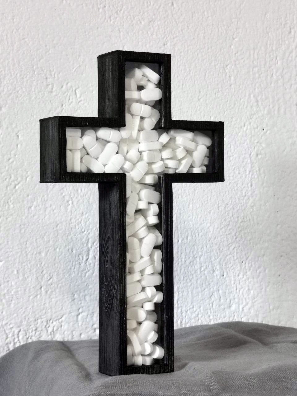 white drug crucifix