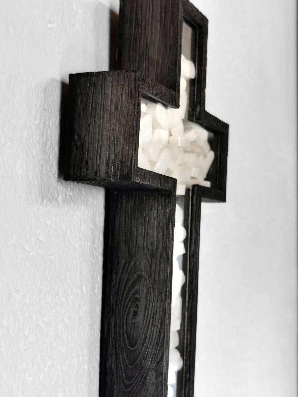 a cross filled with drugs