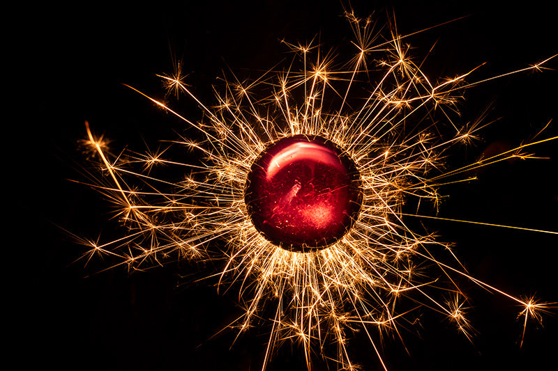 Underwater photograph exploding flower series sparks energy shot Warm Low Light tonality from the Fusion series