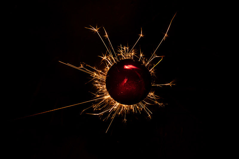 Underwater photograph exploding flower series sparks energy shot Warm Low Light tonality from the Fusion series