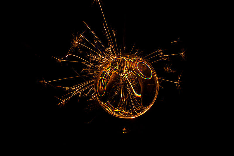 Underwater photograph exploding flower series sparks energy shot Warm Low Light tonality from the Fusion series