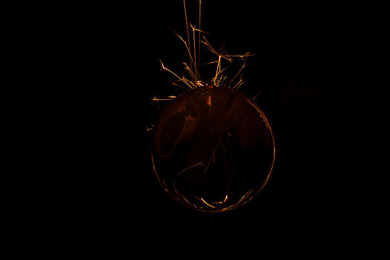 Underwater photograph exploding flower series sparks energy shot Warm Low Light tonality from the Fusion series