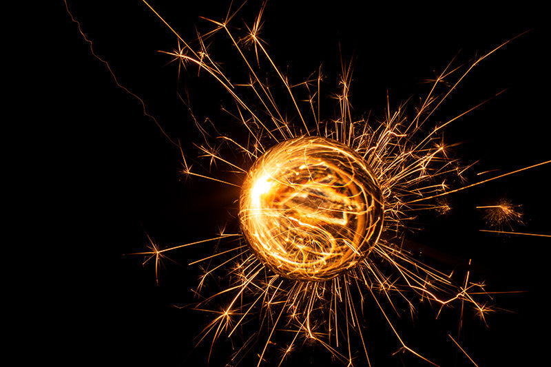 Underwater photograph exploding flower series sparks energy shot Warm Low Light tonality from the Fusion series