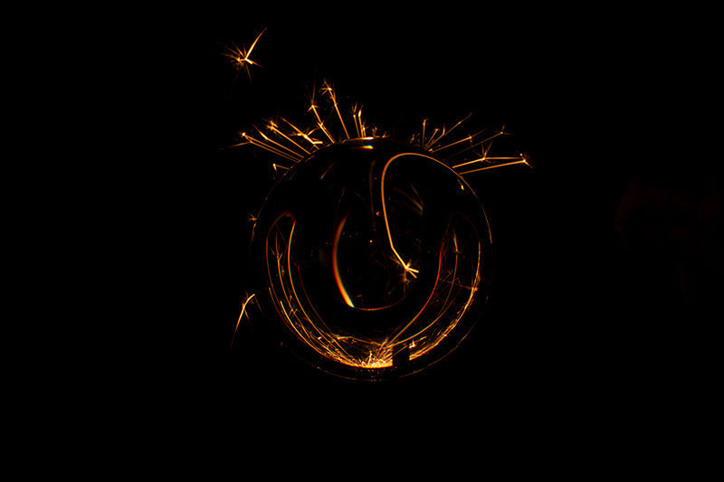 Underwater photograph exploding flower series sparks energy shot Warm Low Light tonality from the Fusion series