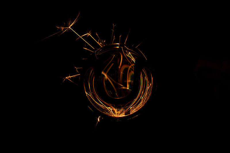Underwater photograph exploding flower series sparks energy shot Warm Low Light tonality from the Fusion series
