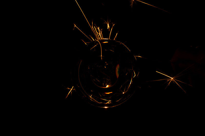 Underwater photograph exploding flower series sparks energy shot Warm Low Light tonality from the Fusion series