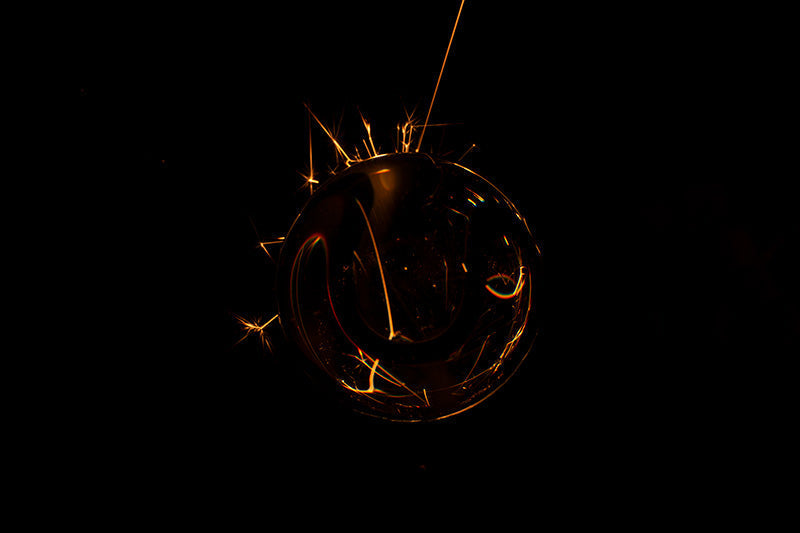 Underwater photograph exploding flower series sparks energy shot Warm Low Light tonality from the Fusion series