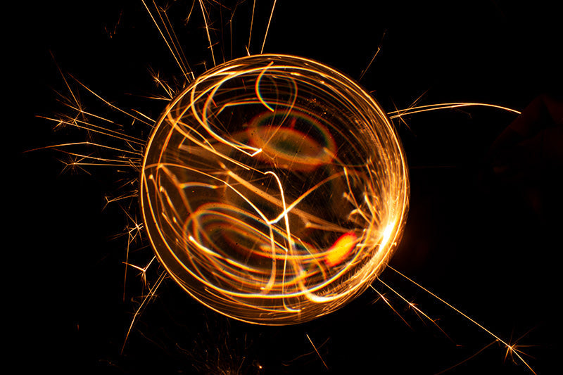 Underwater photograph exploding flower series sparks energy shot Warm Low Light tonality from the Fusion series