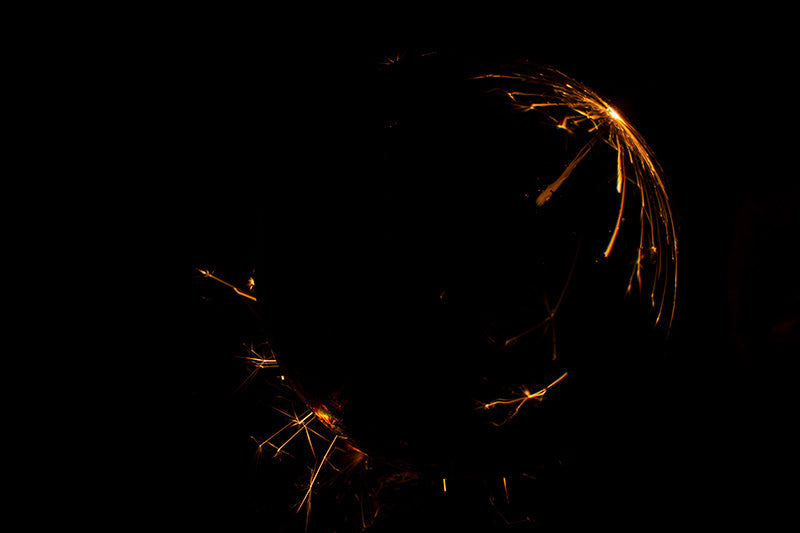 Underwater photograph exploding flower series sparks energy shot Warm Low Light tonality from the Fusion series