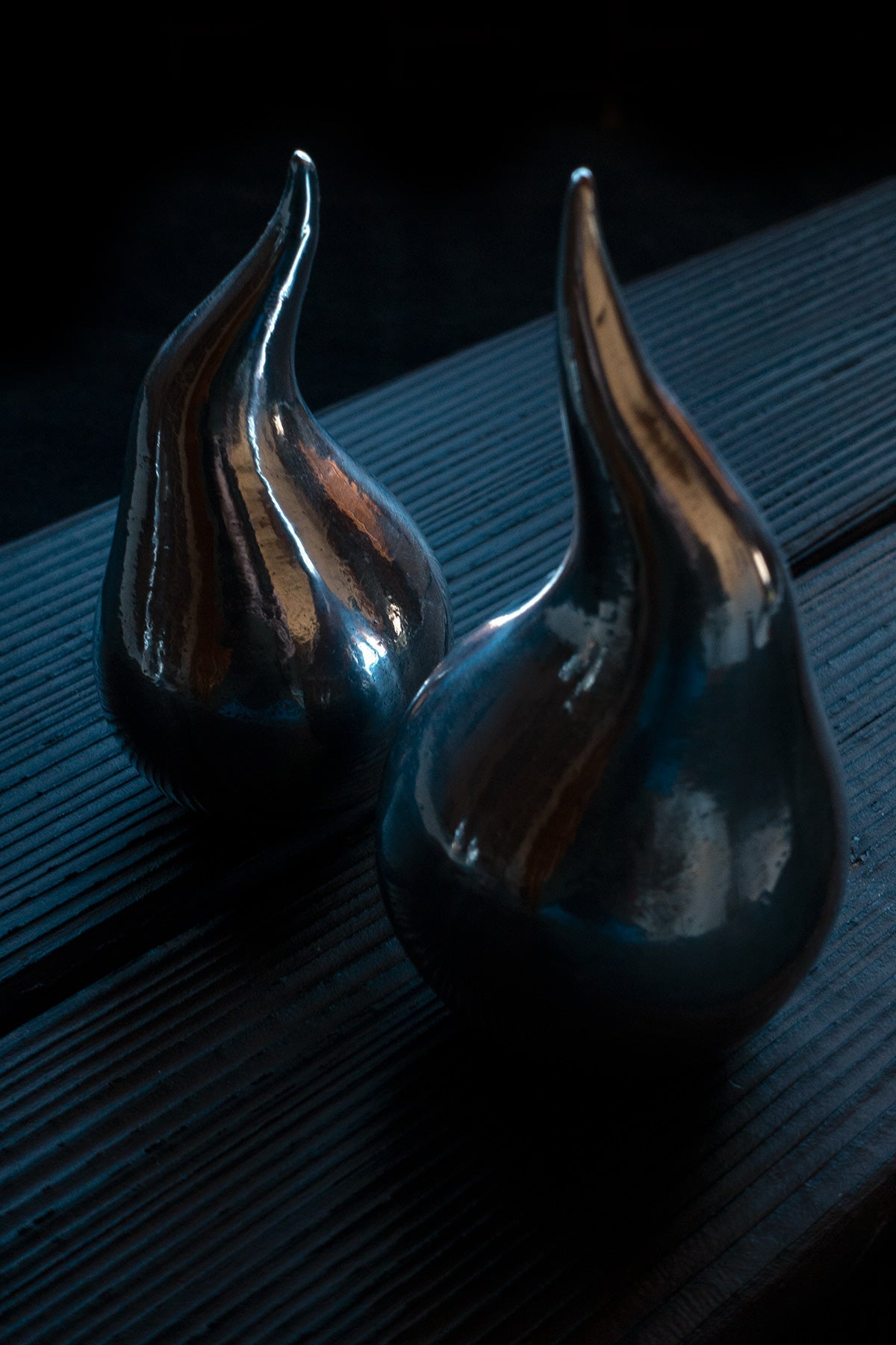 Hand-forged droplet sculpture with artist’s stamp