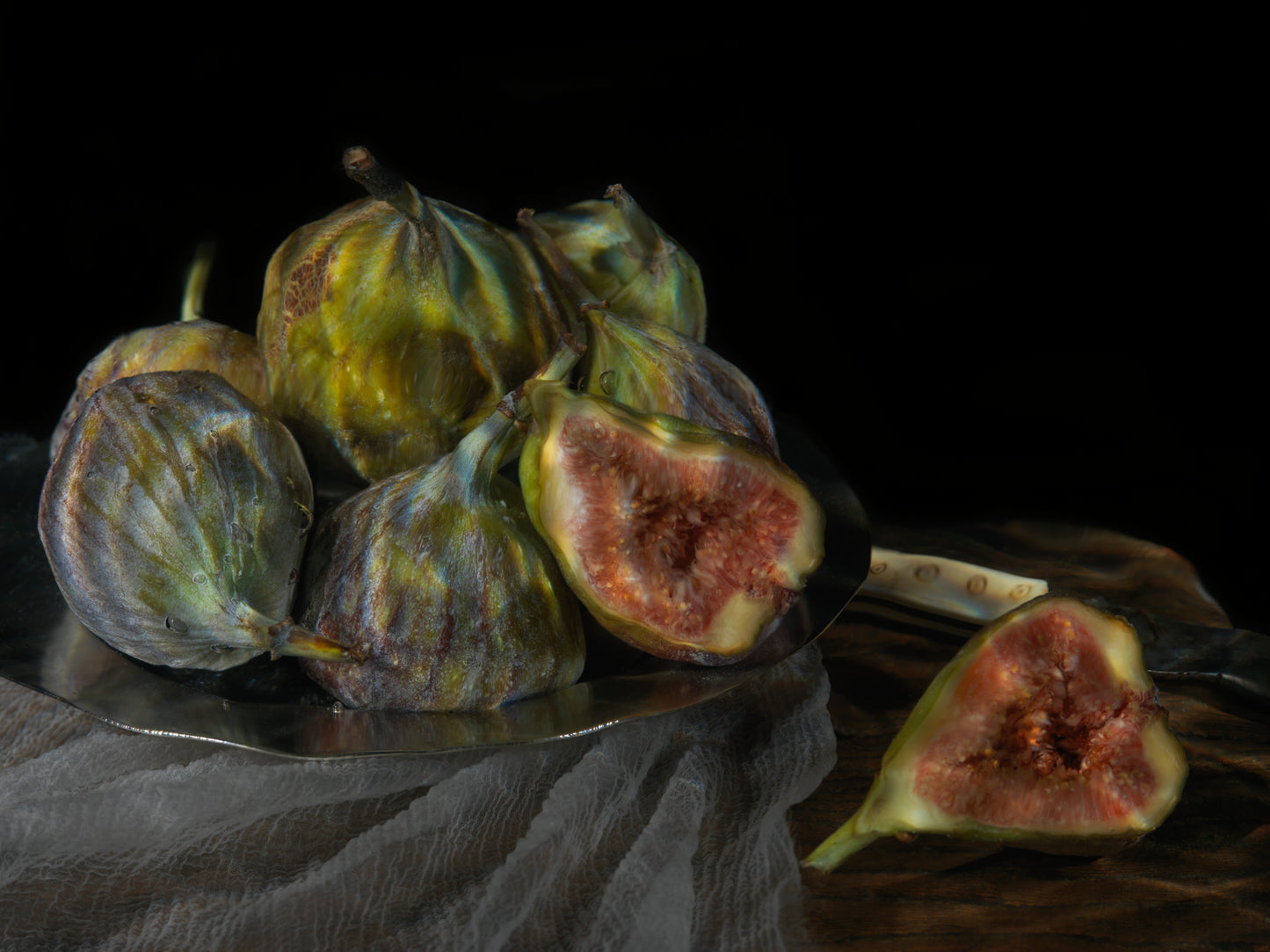 Vanitas still life with figs and reflective surface