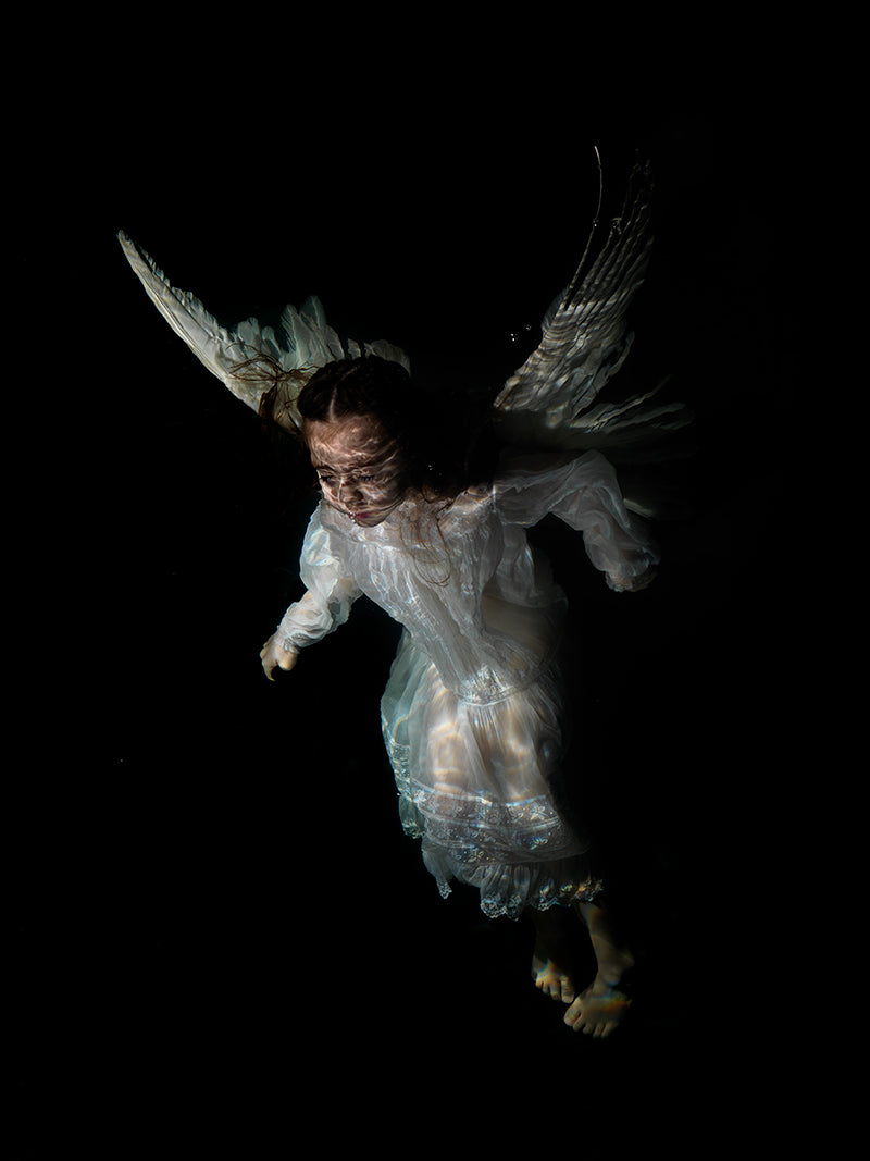 Liquid Lament: Religious Figures Submerged in Underwater Art