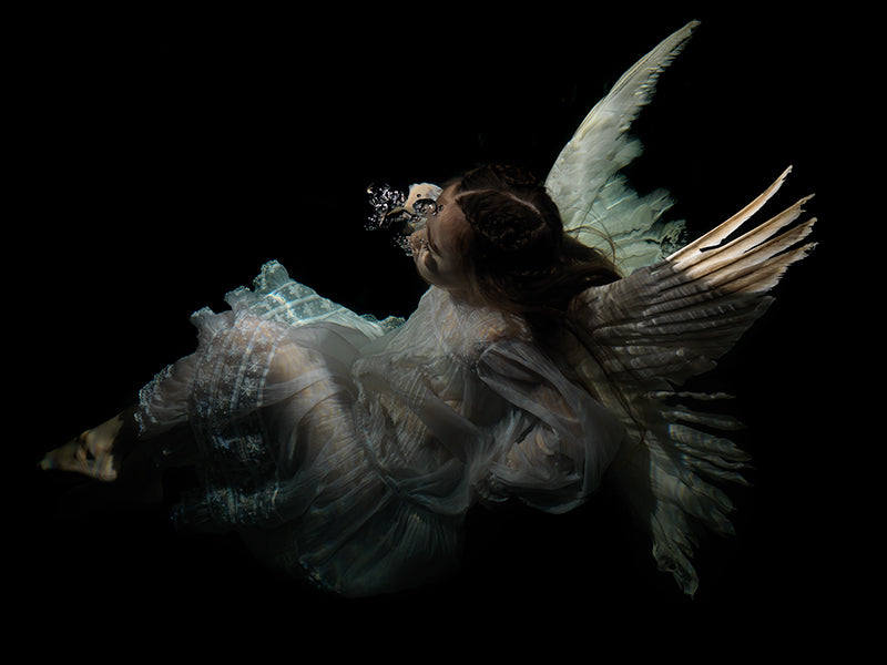 Lost in Myth: Chiaroscuro Depictions of Underwater Sadness