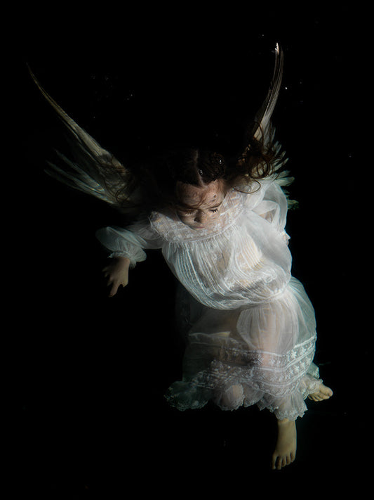 Diving into Drama: Underwater Photographs in the Style of Caravaggio