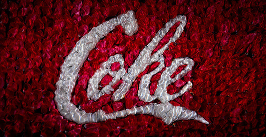the coke red white brand insignia recreated in flowers