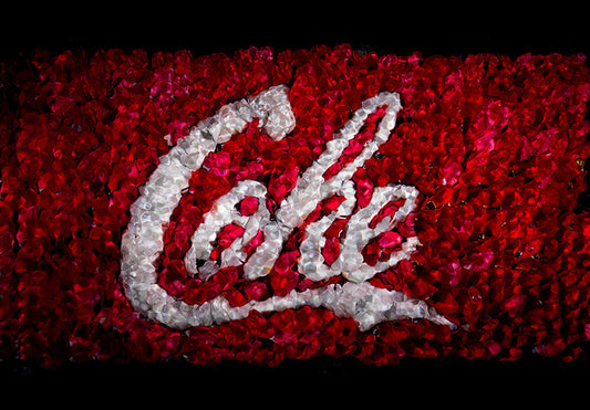 the red and white coke brand in flowers floral in water