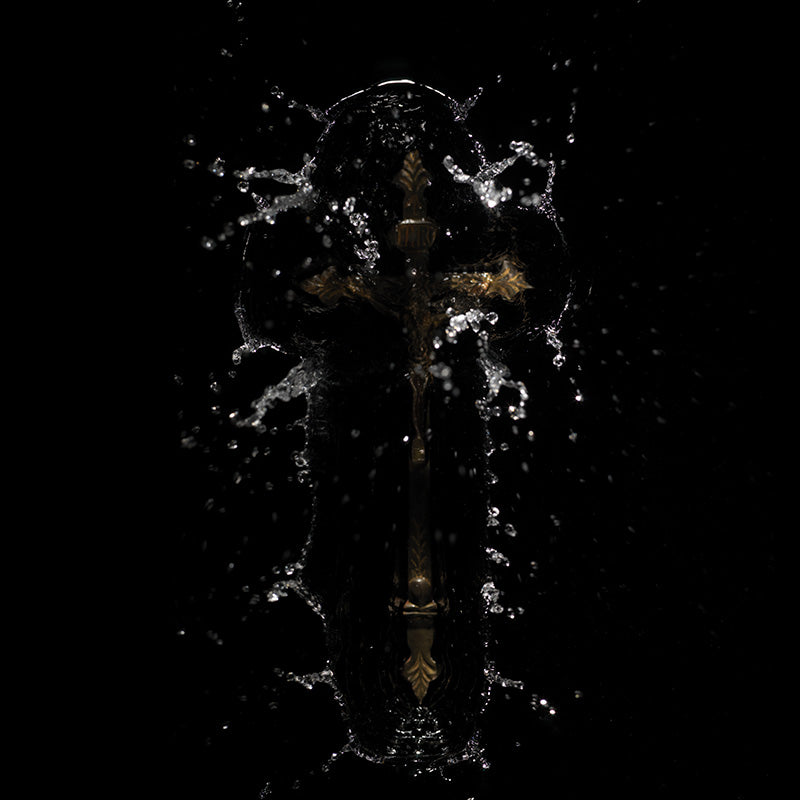 Artist using water and religious iconography motifs icons with photography