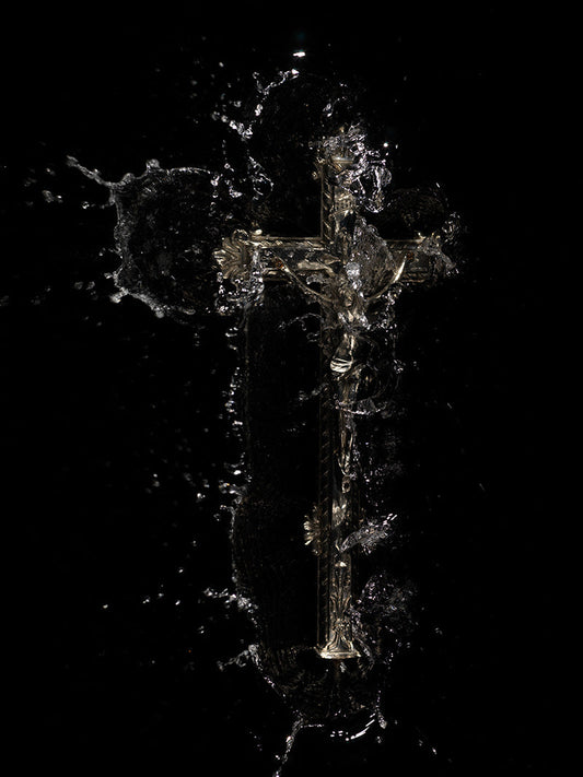 splash crucifixion cross is cast into water recreating a catholic religious scene