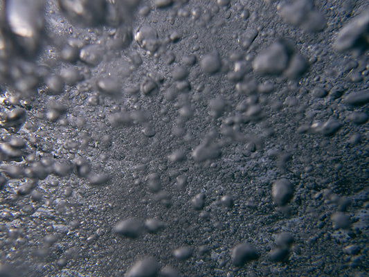 Dancing Bubbles in Shimmering Ocean Light Abstract bubble series in photography