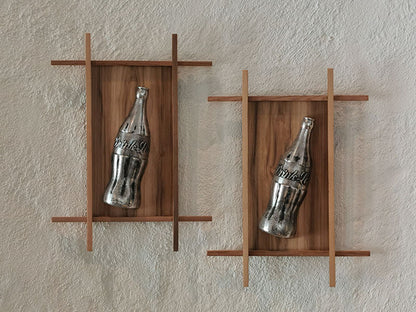 wall mounted coke bottle sculptures a contemporary look at a global polluter