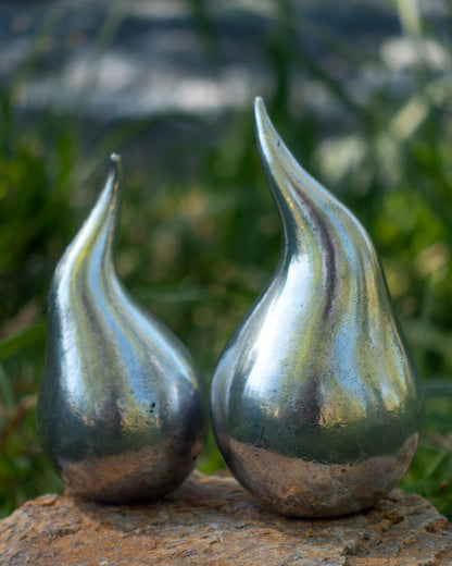 Small and large water droplet aluminium sculptures