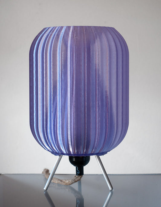 Eco-conscious table lamp with sculptural vortex form