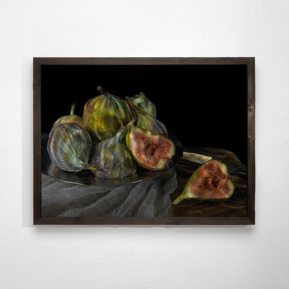 still life plate of fresh cut figs using water as a lens