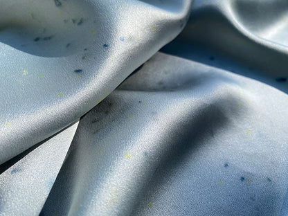 Handmade silk scarf styled on bag and around neck