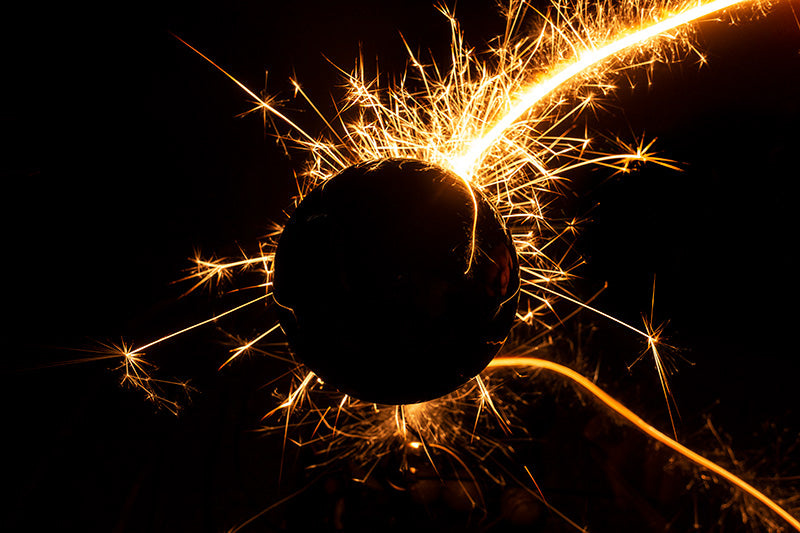 Underwater photograph exploding flower series sparks energy shot Warm Low Light tonality from the Fusion series