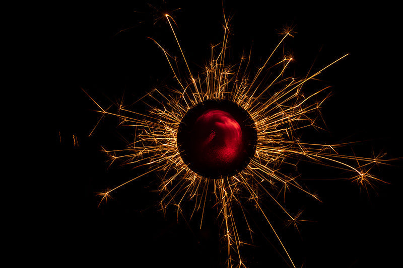 Underwater photograph exploding flower series sparks energy shot Warm Low Light tonality from the Fusion series