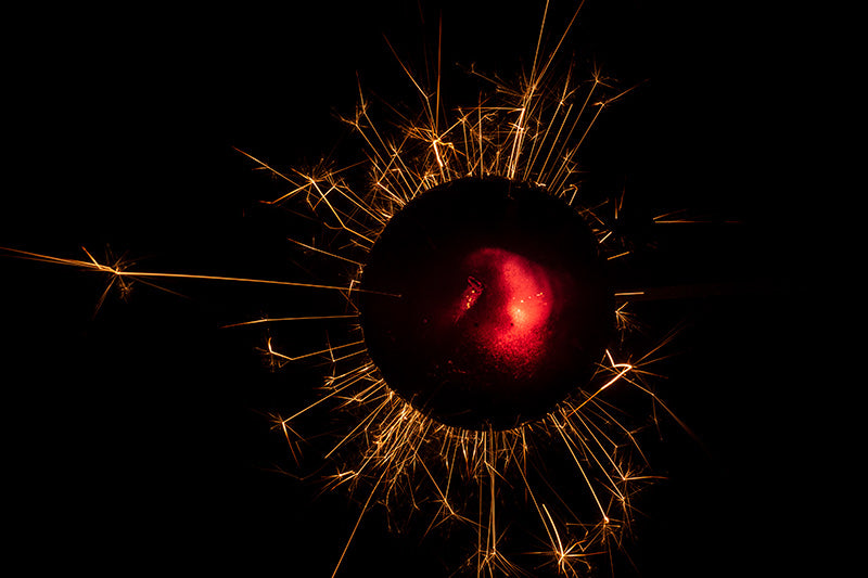 Underwater photograph exploding flower series sparks energy shot Warm Low Light tonality from the Fusion series