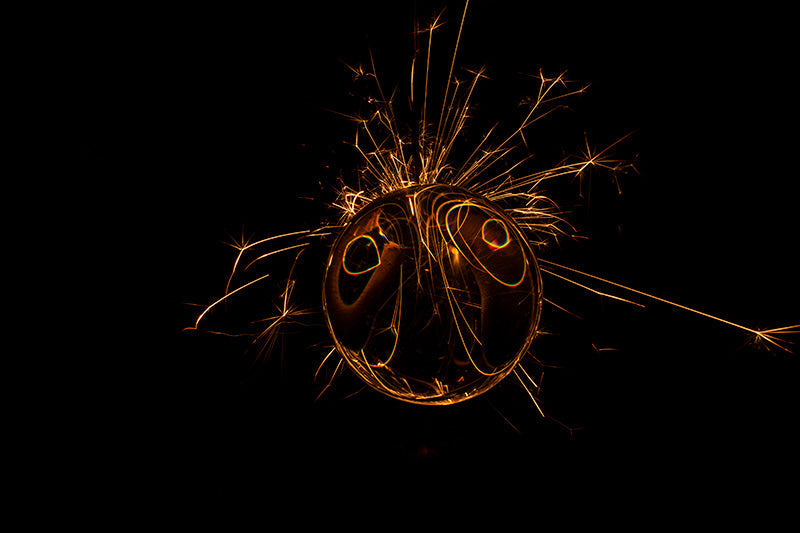 Underwater photograph exploding flower series sparks energy shot Warm Low Light tonality from the Fusion series
