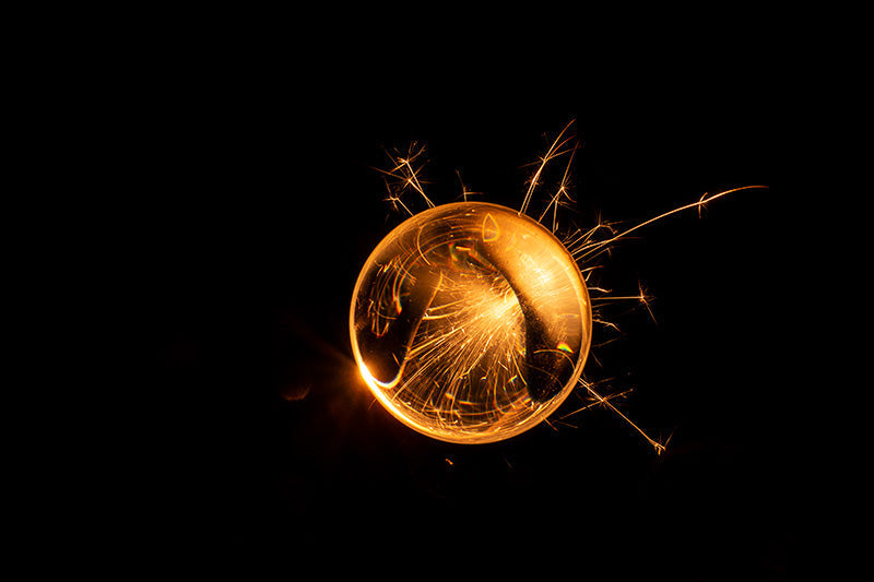 Underwater photograph exploding flower series sparks energy shot Warm Low Light tonality from the Fusion series