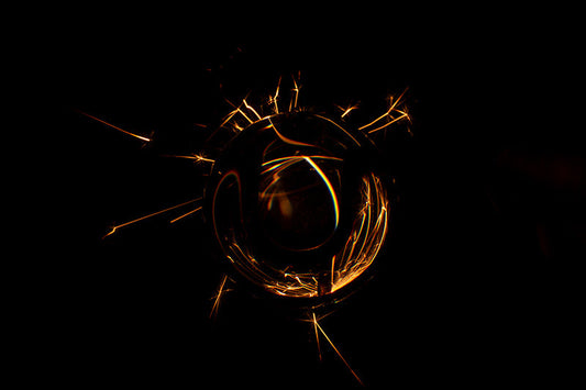 Underwater photograph exploding flower series sparks energy shot Warm Low Light tonality from the Fusion series