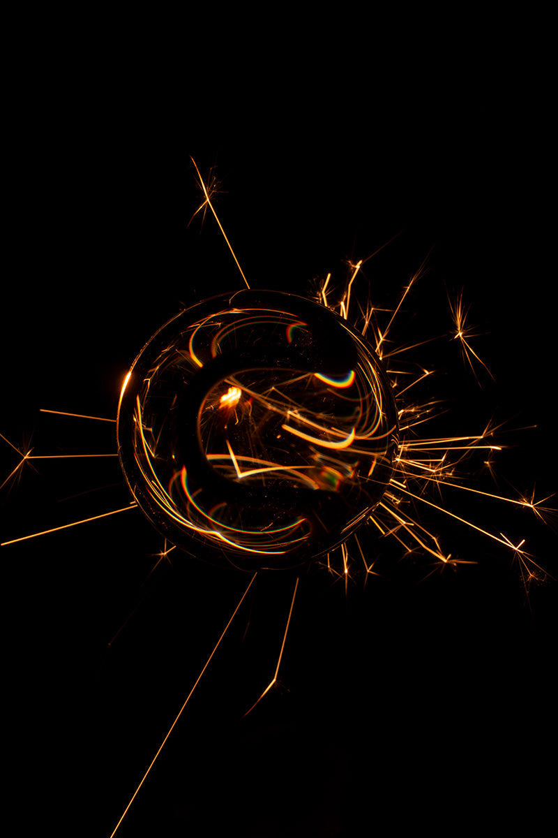 Underwater photograph exploding flower series sparks energy shot Warm Low Light tonality from the Fusion series