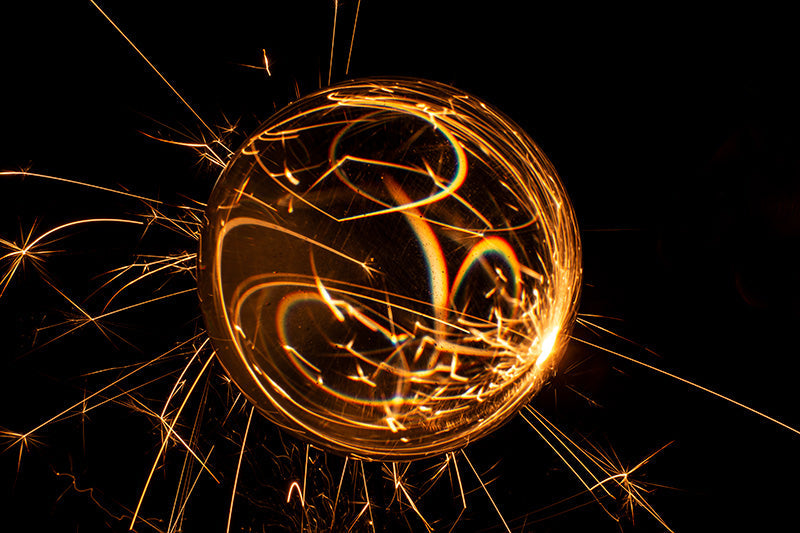 Underwater photograph exploding flower series sparks energy shot Warm Low Light tonality from the Fusion series