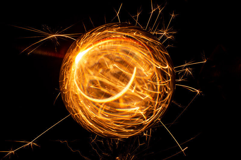 Underwater photograph exploding flower series sparks energy shot Warm Low Light tonality from the Fusion series