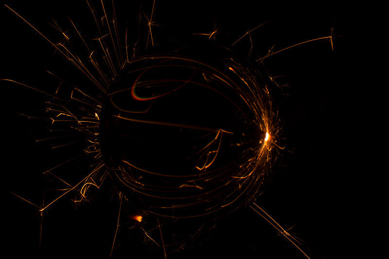 Underwater photograph exploding flower series sparks energy shot Warm Low Light tonality from the Fusion series