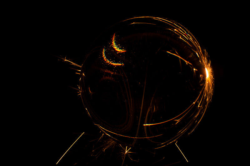 Underwater photograph exploding flower series sparks energy shot Warm Low Light tonality from the Fusion series