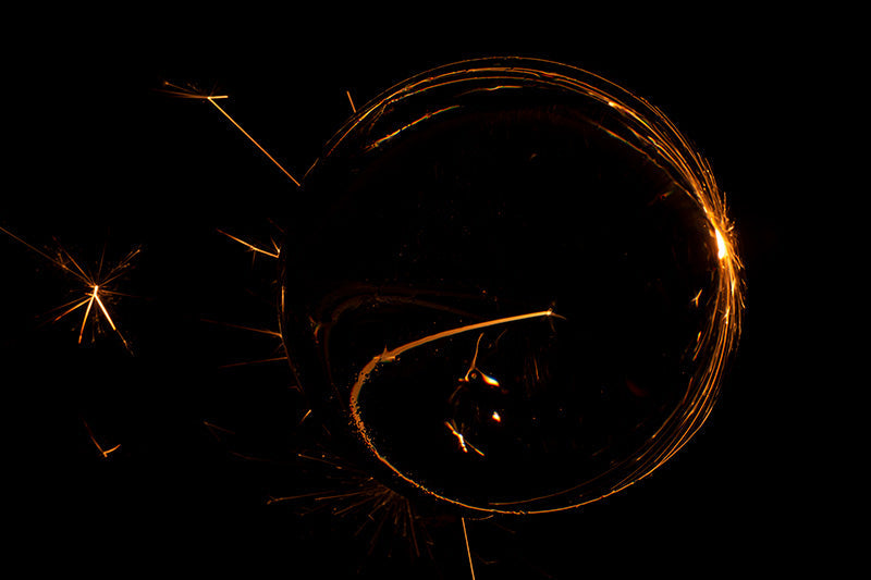 Underwater photograph exploding flower series sparks energy shot Warm Low Light tonality from the Fusion series