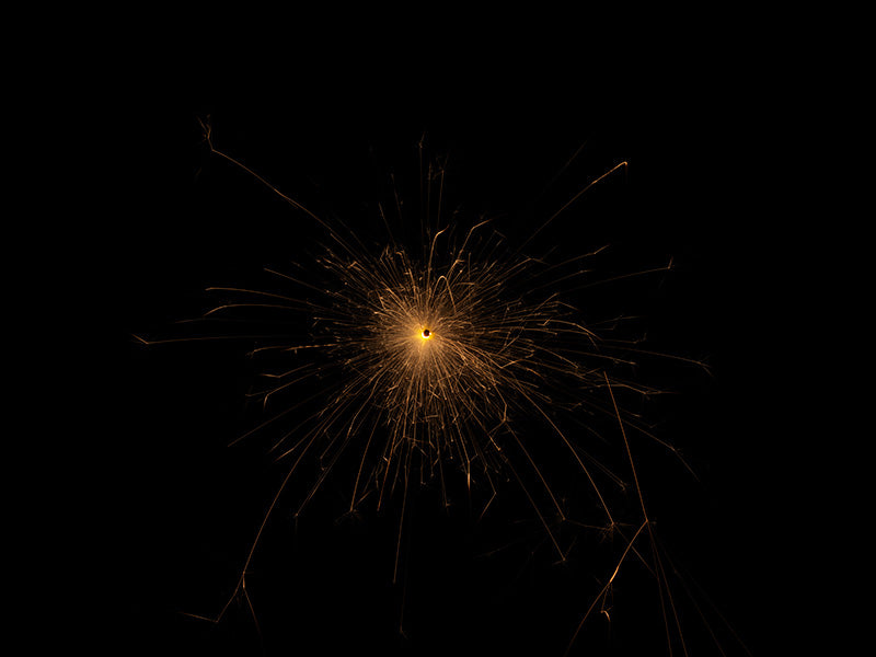 Underwater photograph exploding flower series sparks energy shot Warm Low Light tonality from the Fusion series