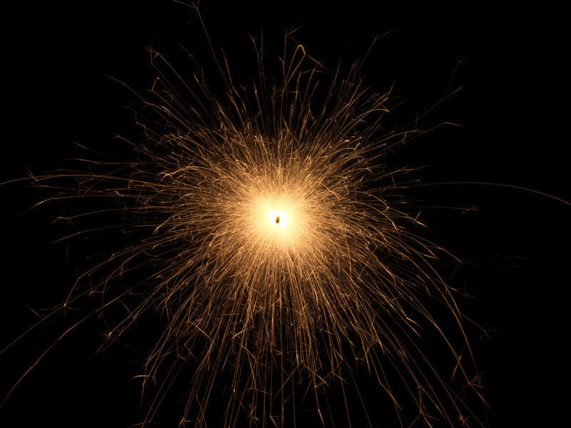 Underwater photograph exploding flower series sparks energy shot Warm Low Light tonality from the Fusion series