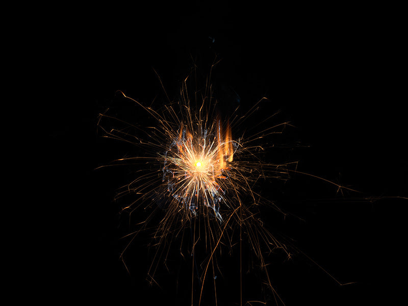 Underwater photograph exploding flower series sparks energy shot Warm Low Light tonality from the Fusion series