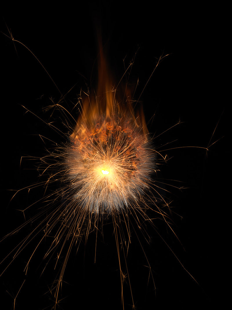 Underwater photograph exploding flower series sparks energy shot Warm Low Light tonality from the Fusion series